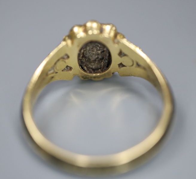 A Victorian 18ct gold, black enamel, seed pear and hardstone set oval mourning ring